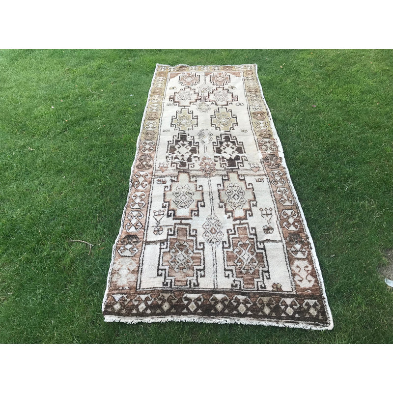 Tapis turc rétro tissé à la main avec motif géométrique dans des tons de terre pour une décoration intérieure unique