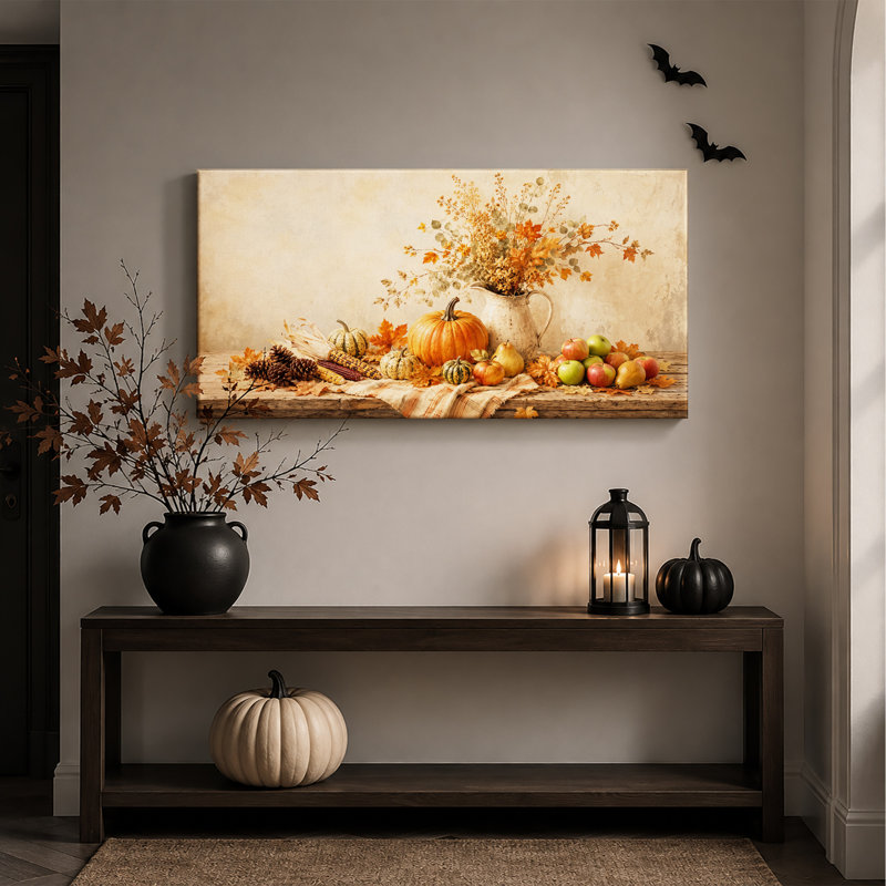 Citrouilles et pommes de la récolte d'automne sur une toile rustique pour l'Halloween