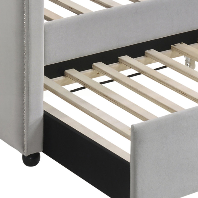 Lit de jour simple gris avec dossier gigogne et capitonné, parfait pour les chambres élégantes et confortables