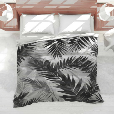Édredon noir avec feuilles de palmier