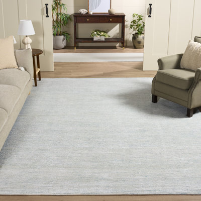 Tapis turquoise / ivoire touffeté à la main Soho