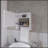 Versatile White Medicine Cabinet With Towel Bar And Included Mirror