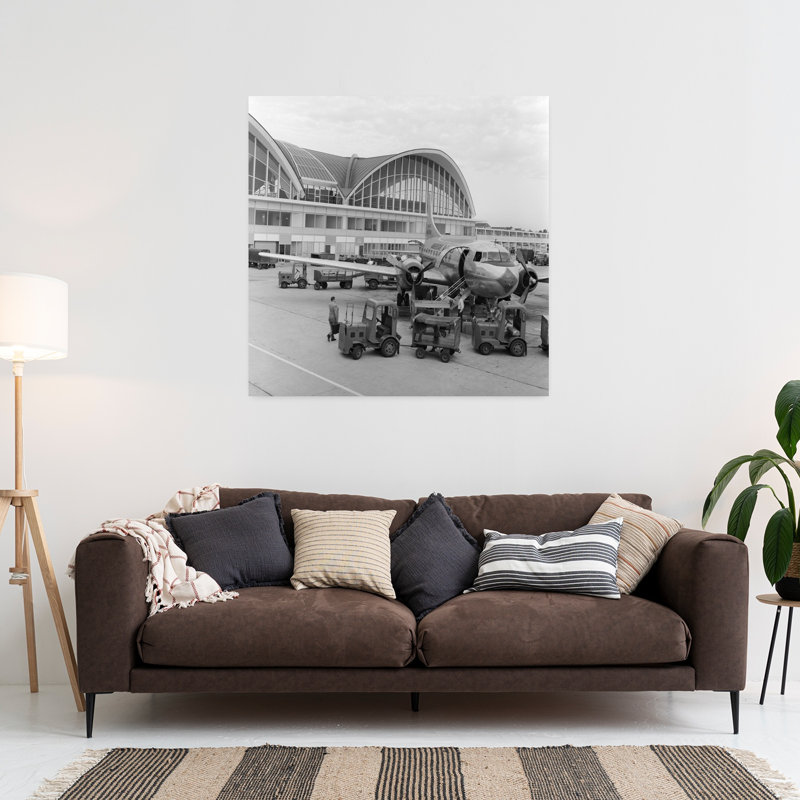 1950s 1960s PROPELLER AIRPLANE ON AIRPORT TARMAC IN FRONT OF TERMINAL WITH MODERN ARCHED WINDOWS ST. LOUIS MISSOURI USA by C. S. Bauer - Wrapped Canvas Print