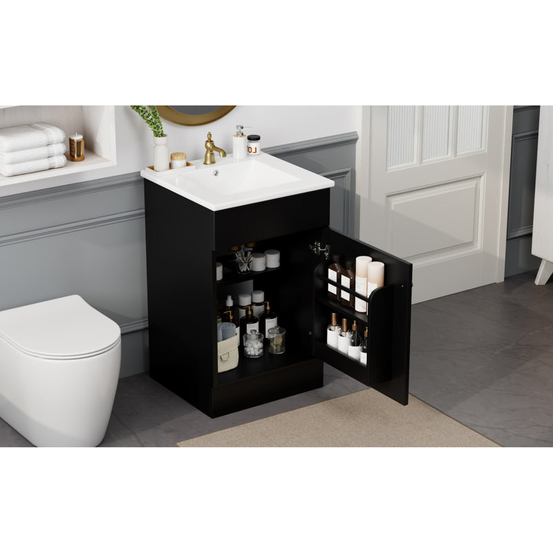 Meuble-lavabo de 20 po avec lavabo, noir. Tablette de porte d'armoire et tablette réglable. Finition lisse du lavabo en céramique. Pour armoire à panneau à utilisation silencieuse. Trou de robinet et surface imperméable. Fermeture silencieuse