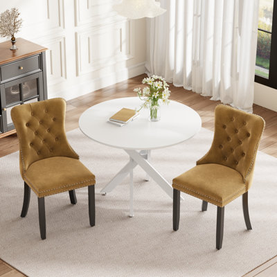 Ensemble de salle à manger rond en bois avec chaise capitonnée