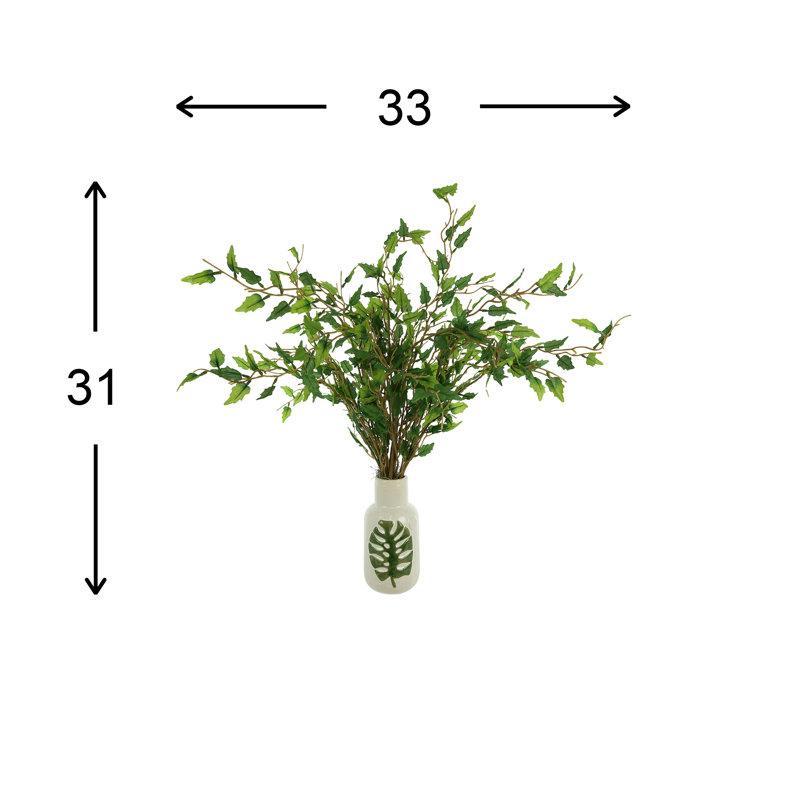 Organic Modern Smilax Arranged In A Ceramic Leaf Vase