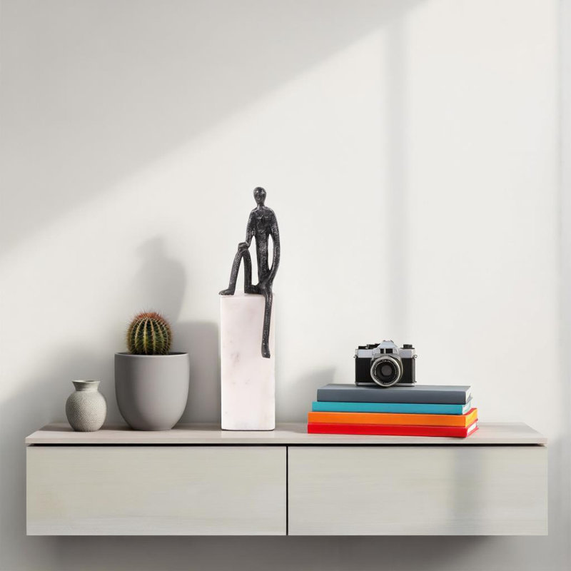 Fogle Sculpture on White Marble Base