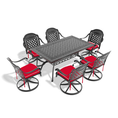 L'ensemble de salle à manger toutes saisons en fonte d'aluminium comprend 6 chaises pivotantes et une table rectangulaire avec une structure noire