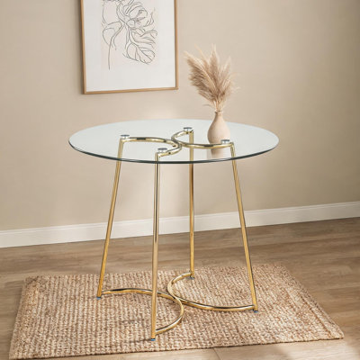 Table de salle à manger ronde avec plateau en verre et structure en acier doré, sièges 4