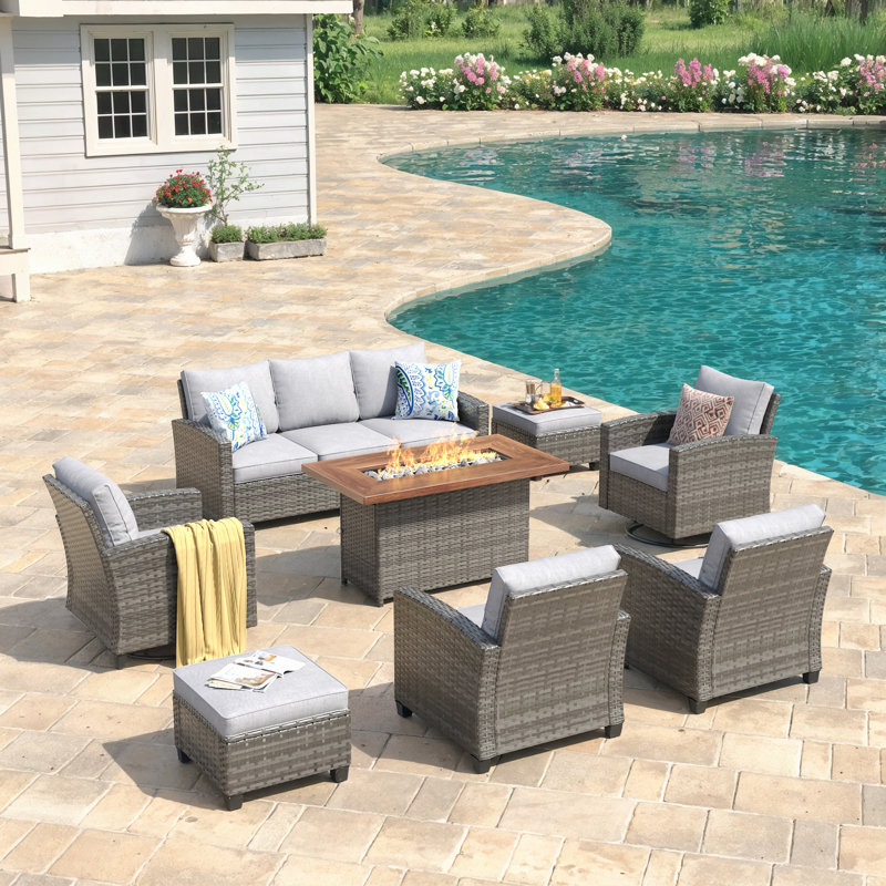 Eldert 7-Person Outdoor Conversation Set with 3-seat Sofa, Sofa Chairs, Swivel Rocking Chairs, Rattan Firepit Table, and Ottomans