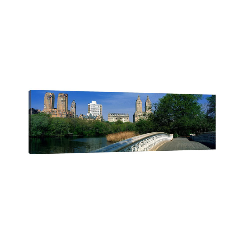 View Of Historic Buildings Along Central PArk West From Bow Bridge - Wrapped Canvas Panoramic Print