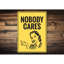 Enseigne en aluminium «None Cares»-58203600