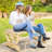 Rustic Outdoor Bench For 2 - Wooden Garden Seat With Wagon Wheel Design Legs, 550 Lbs Load Capacity, Natural Patio Bearing, Finish
