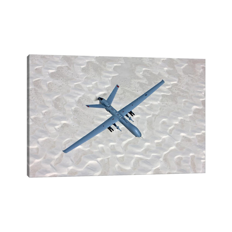 An MQ-9 Reaper Flies A Training Mission Over Southern New Mexico by HIGH-G Productions - Wrapped Canvas Print