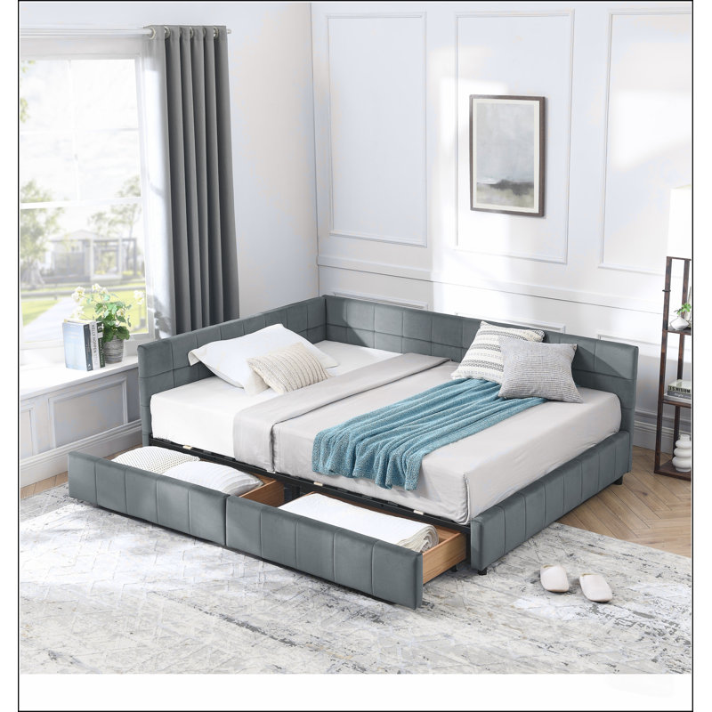 Lit double capitonné avec rangement, dossier, accoudoirs et revêtement en velours gris, au design confortable comme un canapé.