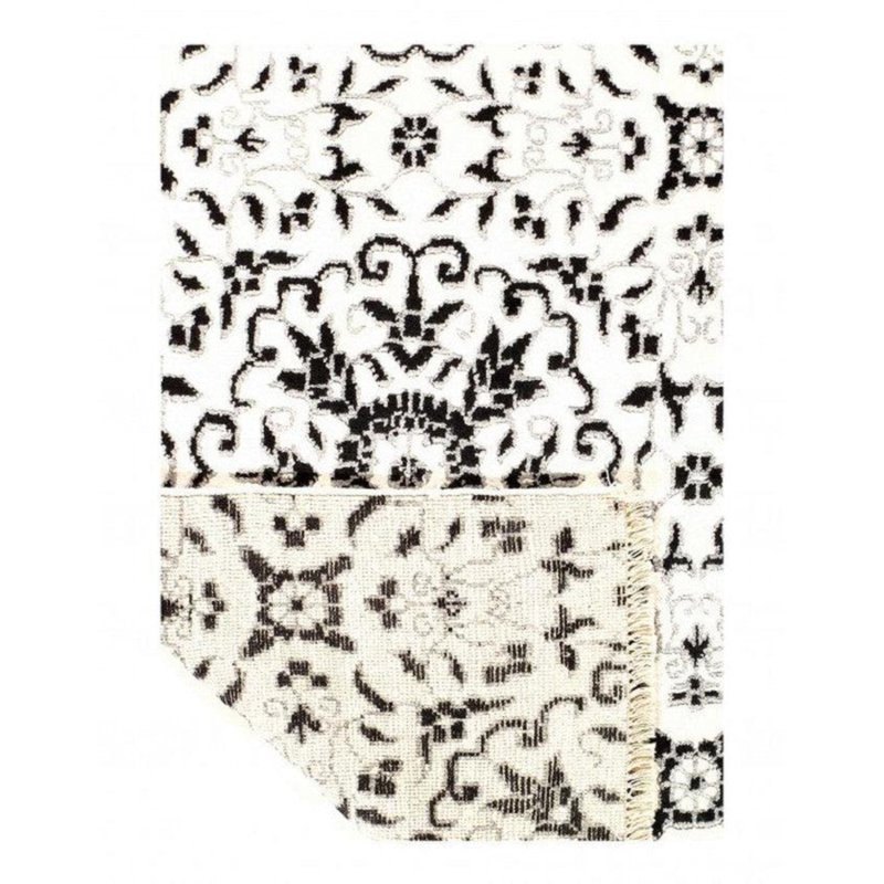 Niviah Floral Area Rug in White