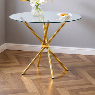 Une table ronde circulaire en verre trempé transparent d'un diamètre de 36,6 pouces, avec des pieds en métal froncés en forme d'anneau. Le verre du bureau a une épaisseur de 0,3 pouce.