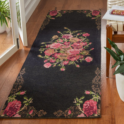 Tapis noir / rouge à motif floral Tammie