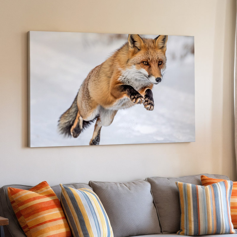 Toile, un renard roux vif au milieu du saut capturé dans un art mural Pose dynamique qui met en valeur son agilité et sa grâce