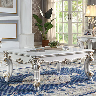 Table basse avec pieds à volutes
