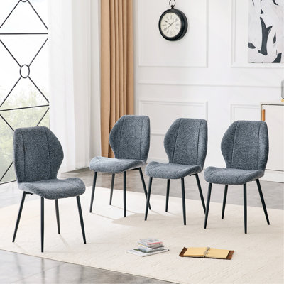 Ensemble de 4 chaises de salle à manger minimalistes modernes en tissu bleu smog, avec des coussins spacieux et confortables. Pieds en métal noir et pieds réglables, convenant à la salle à manger, au bureau et au bureau, etc.