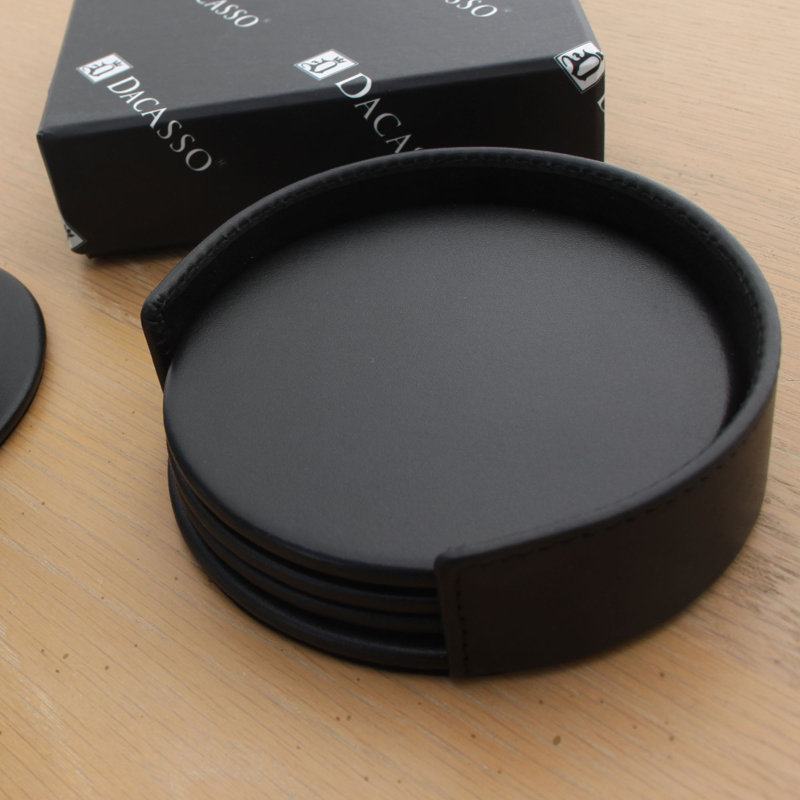 Ensemble de quatre sous-verres ronds avec porte-papier noir Bramfield