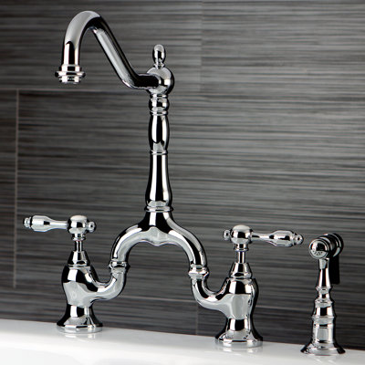 Kingston Brass Tudor Two-Handle 3-Hole Deck Mount Bridge Kitchen Faucet with Brass Side Sprayer