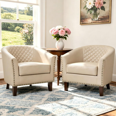 Edvardas Upholstered 29.11 Wide Beige Faux Leather Tufted Barrel Club Chair with Nailhead Trim