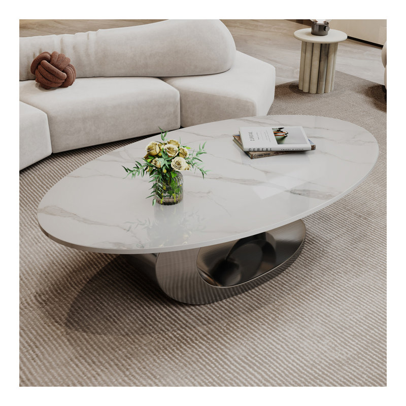 Table basse en marbre avec base sculpturale en acier inoxydable