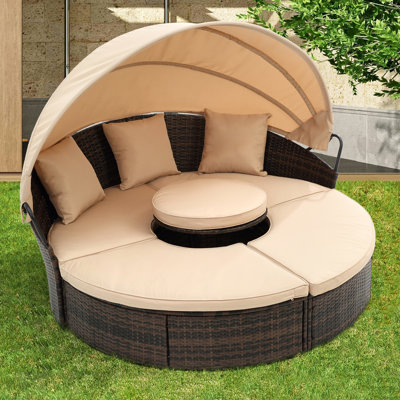 Lit de jardin rond avec auvent : et coussins en mousse haute densité pour un confort optimal.
