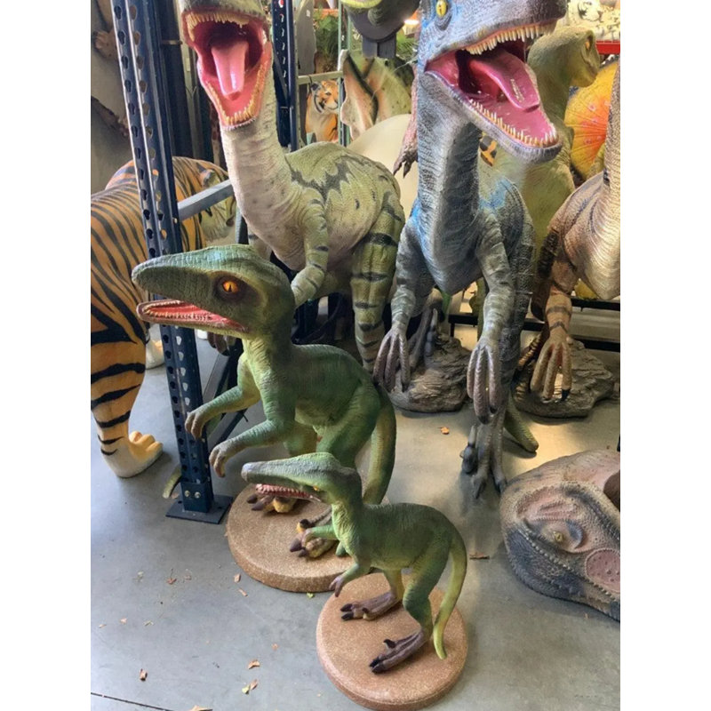 Statue de petit dinosaure petit rapace vert