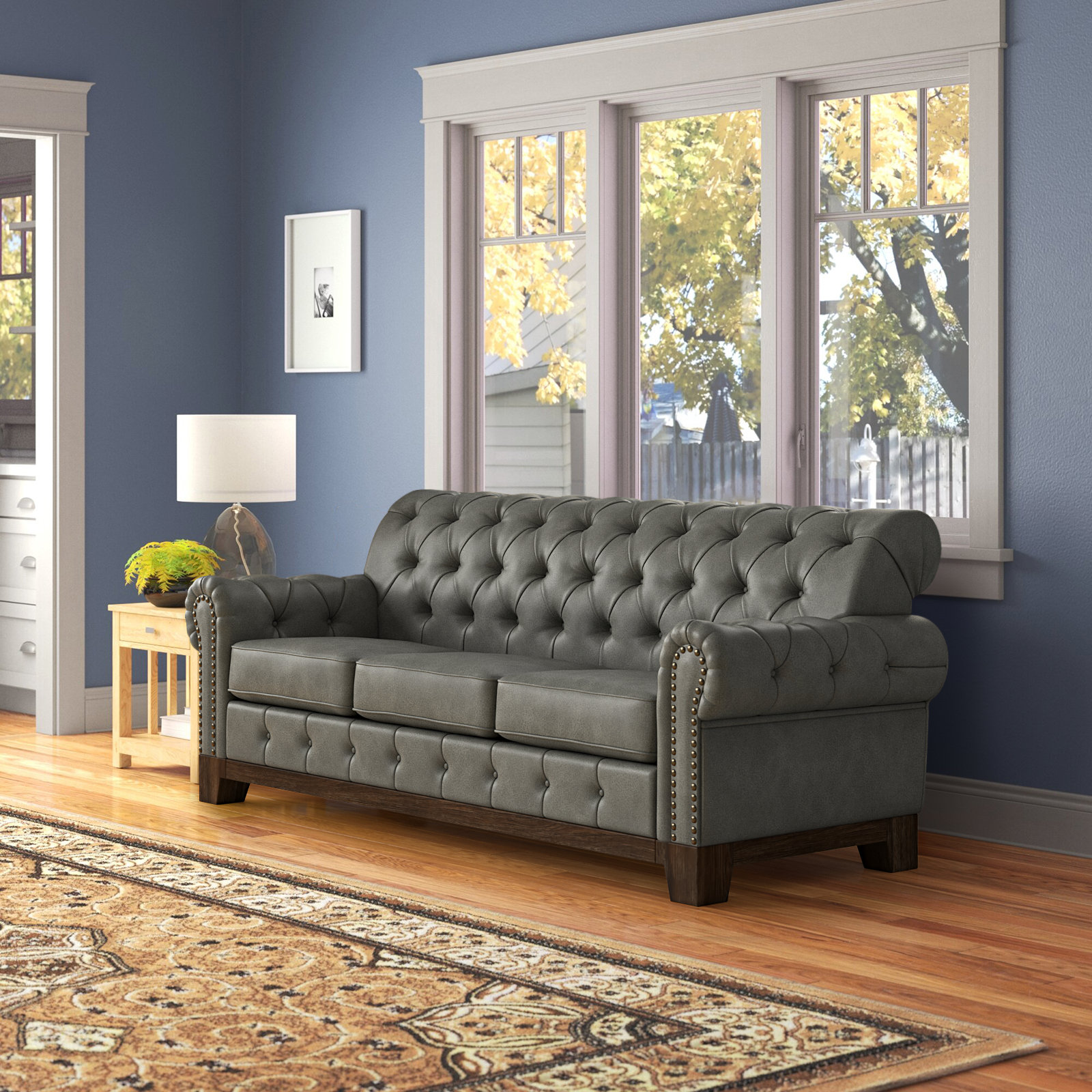 Tufted rolled outlet arm sofa