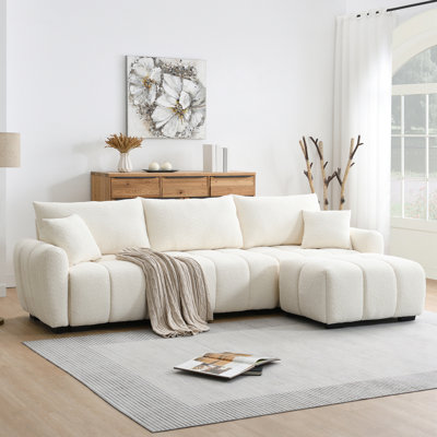 Canapé modulaire en L avec repose-pieds mobile