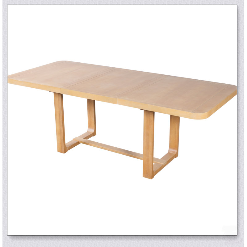 Table de salle à manger extensible en bois massif avec rallonge amovible et coins arrondis pour des espaces polyvalents de convivialité à la maison