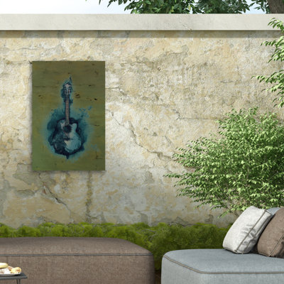 Marcus Jules, guitare brûlante sur toile vert foncé