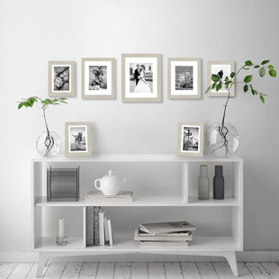 https://assets.wfcdn.com/im/34855922/resize-h310-w310%5Ecompr-r85/2240/224016329/picture-frame-set-7-pieces-with-one-11-x-14-two-8-x-10-and-four-5-x-7-collage-wall-decor.jpg