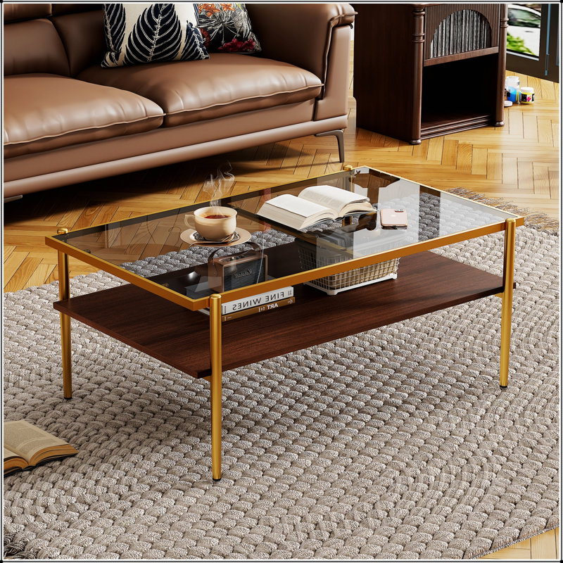 Table basse rectangulaire avec plateau en verre trempé gris et pieds dorés, parfaite pour décorer un salon moderne, Doré