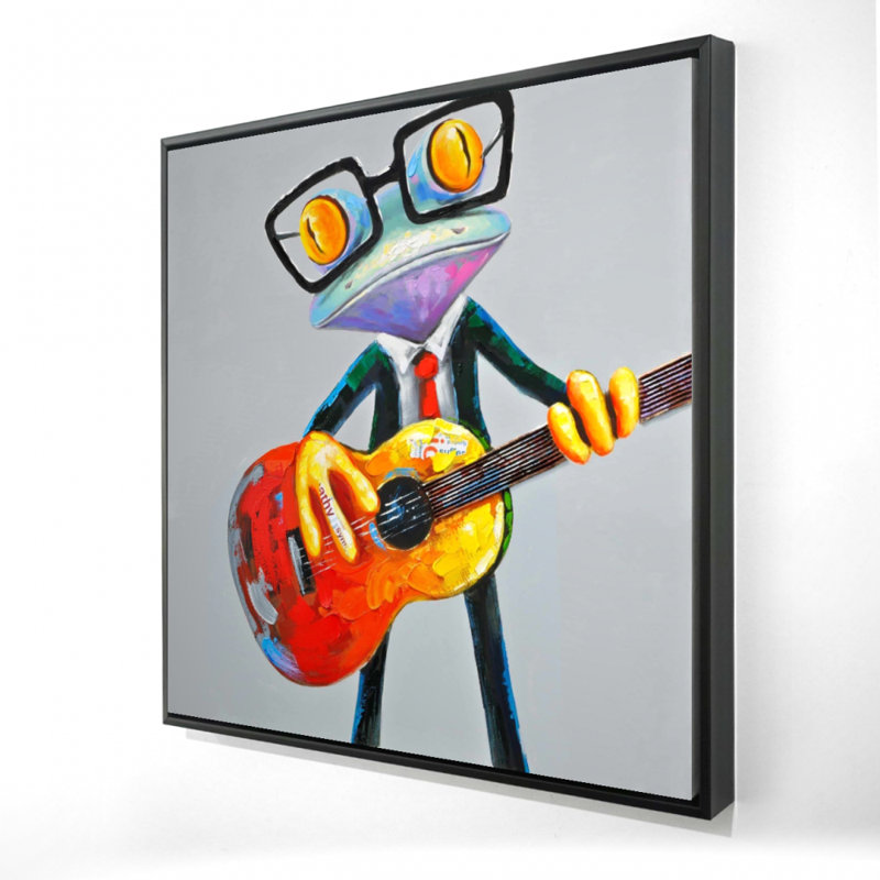 Drôle de grenouille jouant de la guitare