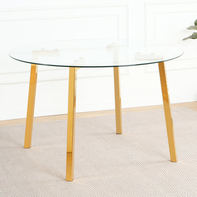 Table de salle à manger ronde moderne en verre transparent avec pieds en métal galvanisé et chaise en polyuréthane noire pour la maison