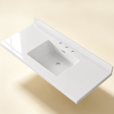 Plan de toilette en surface solide de 122 cm (L) × 56 cm (P) avec lavabo central simple intégré, blanc, dosseret de 9 cm et 3 trous prépercés pour robinetterie à entraxe de 20 cm.