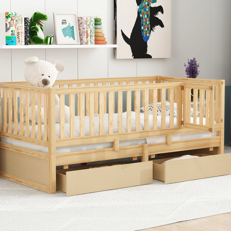Lit de jour simple en bois naturel avec garde-corps et tiroirs de rangement, dans le lit au sol, idéal pour les chambres d'amis