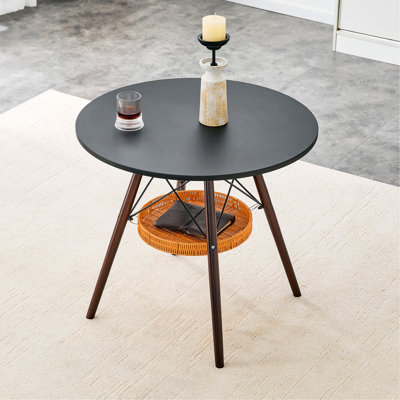 31.5-Inch Diameter Circular Dining Table, Black MDF Vacuum Formed Tabletop, Walnut  Wood Legs, With Suspended Woven Storage Basket Structure. A Casual Coffee Table Suitable For 2-4 People.