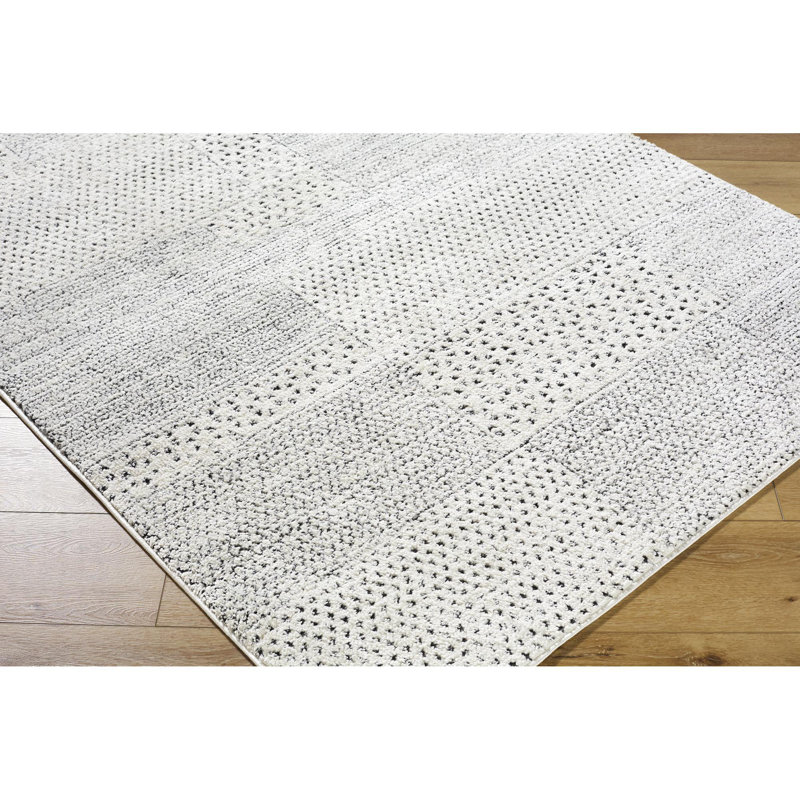 Livabliss 8' x 10' Ivory and Black Synthetic Patchwork Area Rug