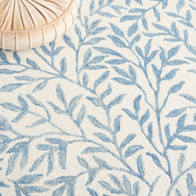 Iqarar Hand Tufted Wool/Cotton Floral Rug in Blue/Ivory