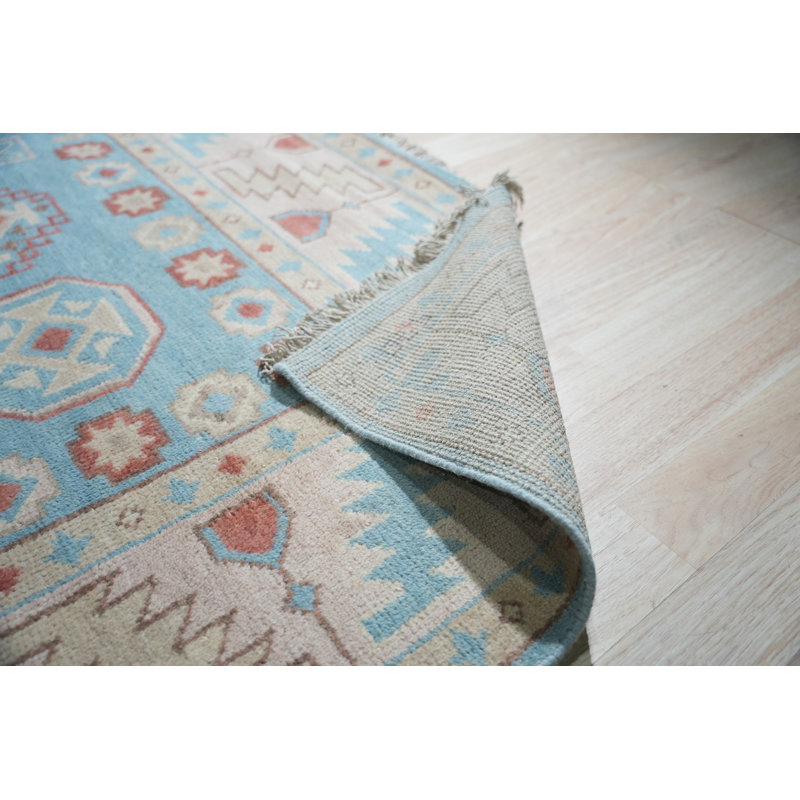 Tapis traditionnel en laine noué à la main bleu clair Keeley