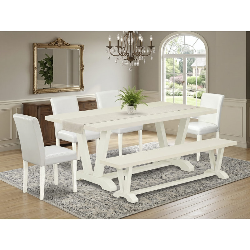 L'ensemble de table de salle à manger 6 pièces comprend une table rectangulaire en lin blanc et un petit banc, ainsi que 4 chaises de salle à manger Parson en cuir de polyuréthane blanc à dossier haut en lin brossé blanc.