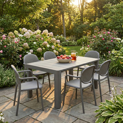 Setebos 6 - Person Plastic Patio Dining Set Table, with Cushions Included
