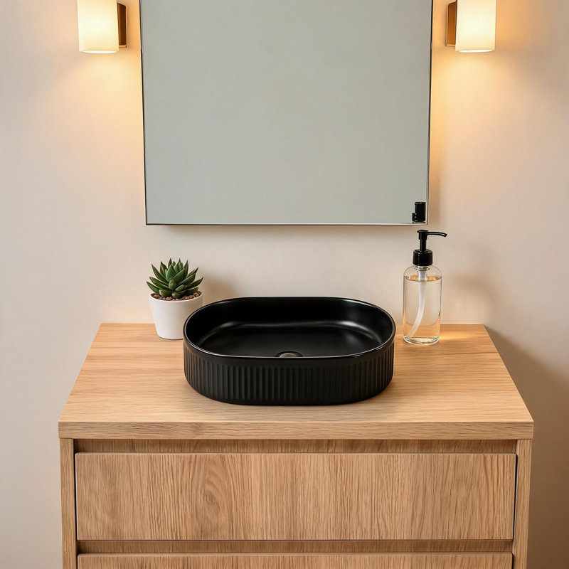 Lavabo ovale en céramique noire de 48 cm x 30 cm avec fini lustré