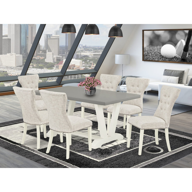 Cet ensemble de table de salle à manger 7 pièces comprend un fauteuil Parson en bois patiné et 6 chaises parsemées de tissu lin lin avec dossier capitonné - Lin brossé blanc