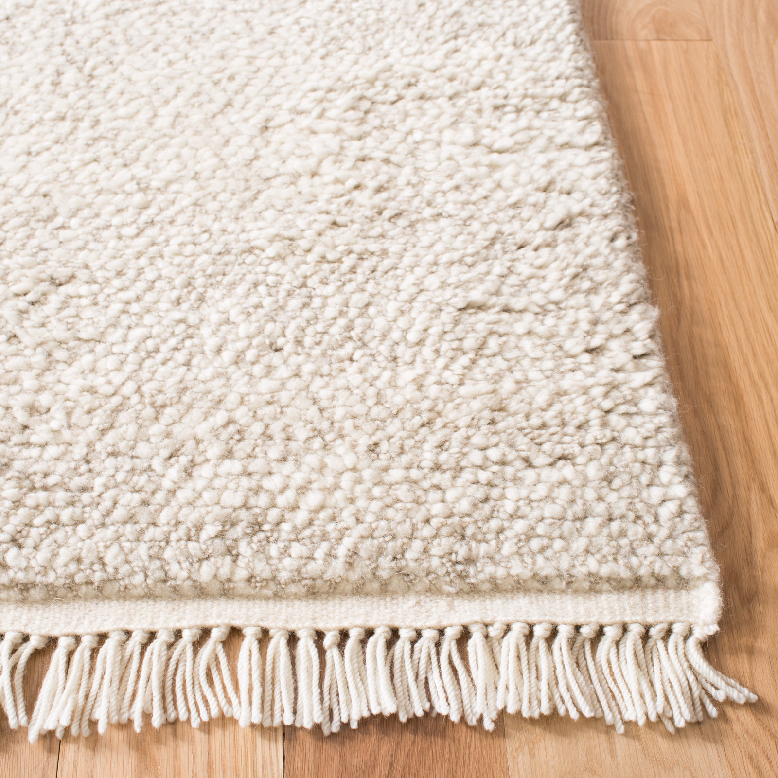Wyly Beige Handmade Shag Wool Rug, Rectangle 2'3" x 4'